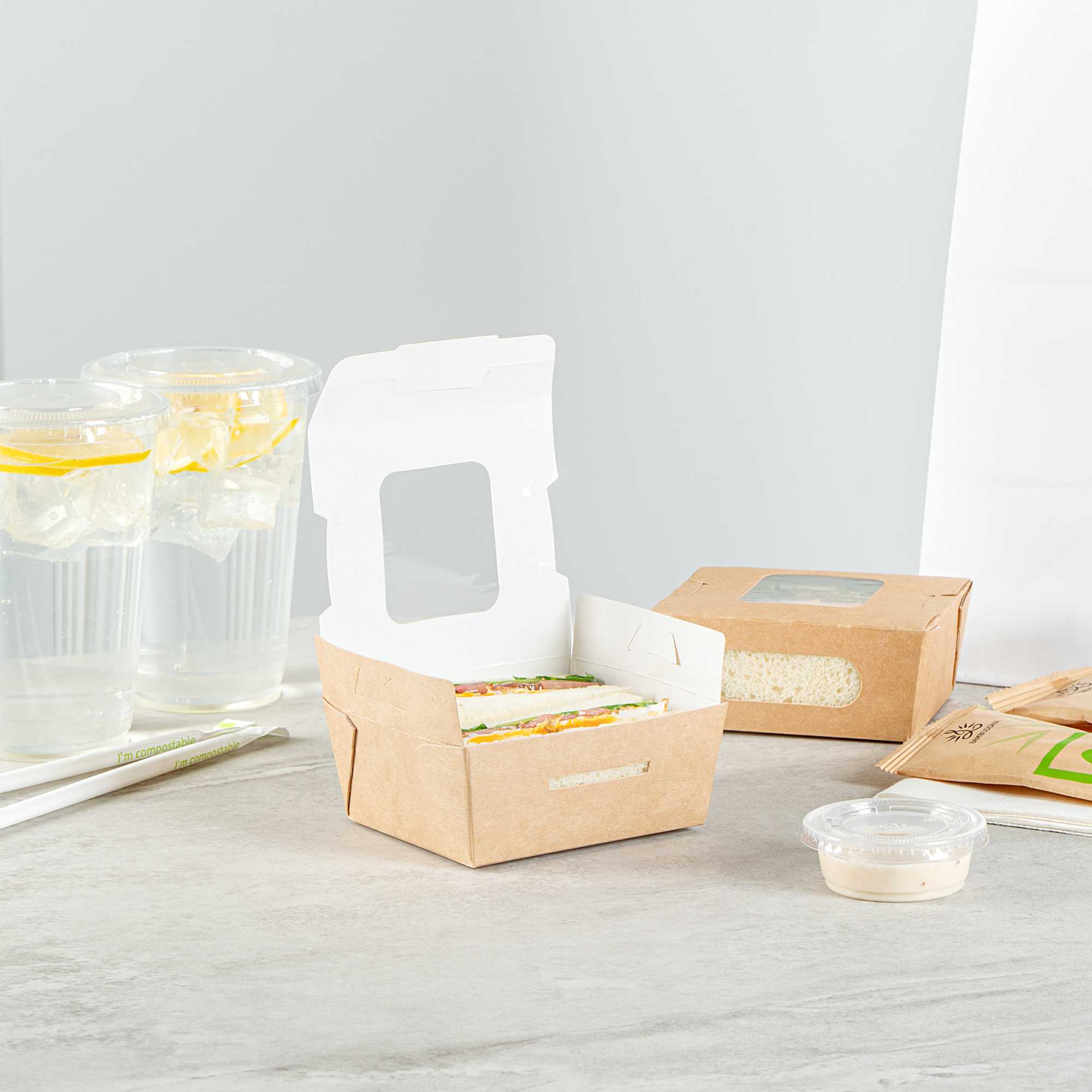 Cafe Vision 12 oz Rectangle Kraft Paper Mini Bio Take Out Container - Two Windows - 4 1/4" x 3 3/4" x 1 3/4" - 200 count box