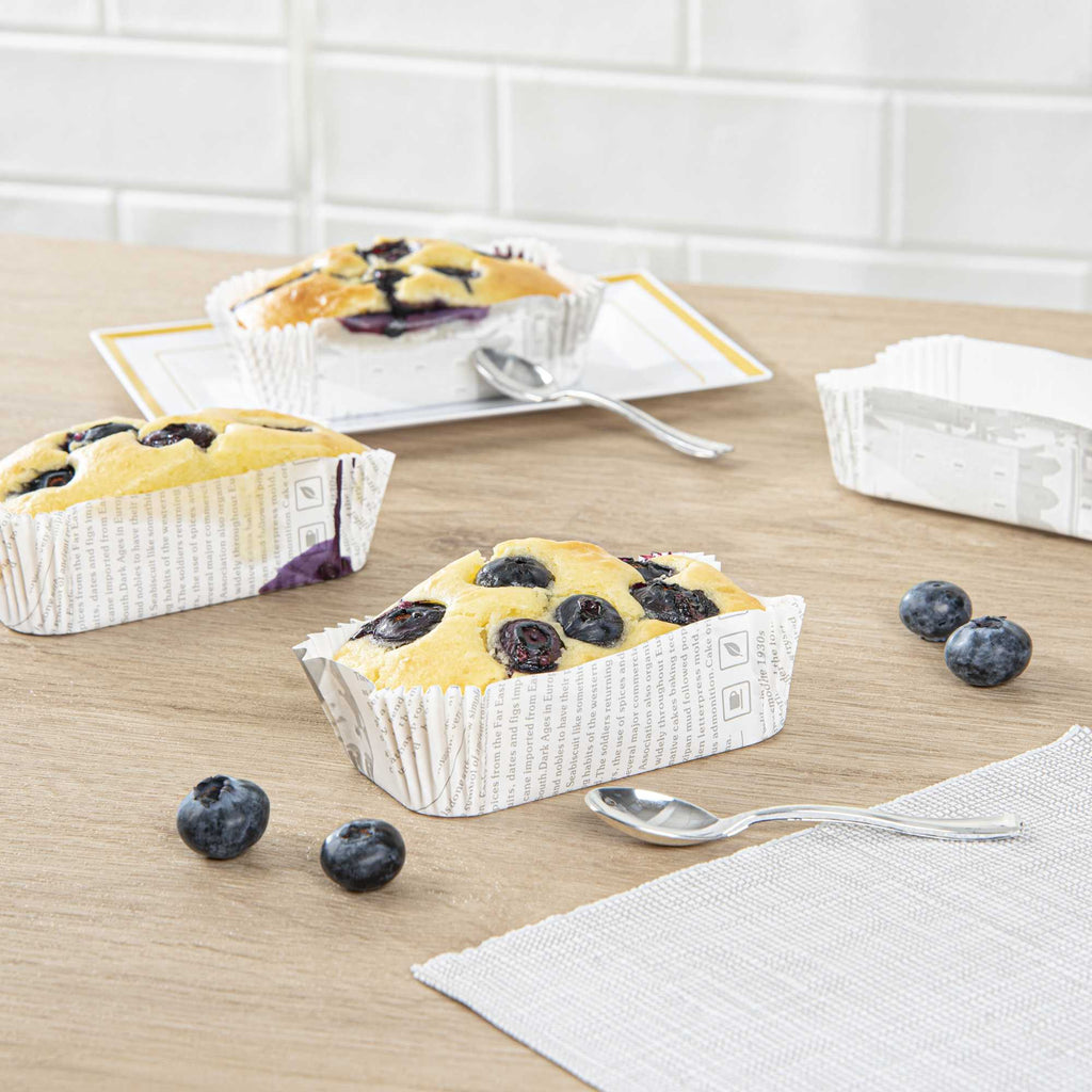 Panificio 5 oz Elliptical Newsprint Paper Large Baking Cup - Ridged - 4 1/2" x 2 1/2" x 1 1/4" - 200 count box