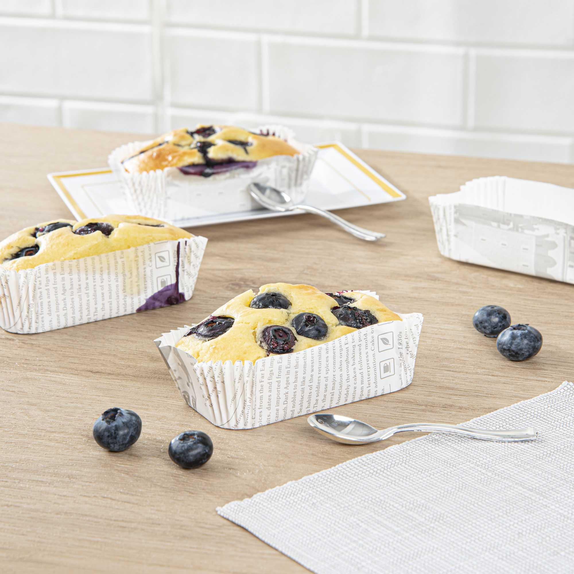 Panificio 5 oz Elliptical Newsprint Paper Large Baking Cup - Ridged - 4 1/2" x 2 1/2" x 1 1/4" - 200 count box