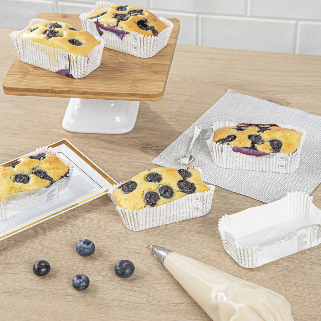 Panificio 5 oz Elliptical Newsprint Paper Large Baking Cup - Ridged - 4 1/2" x 2 1/2" x 1 1/4" - 200 count box