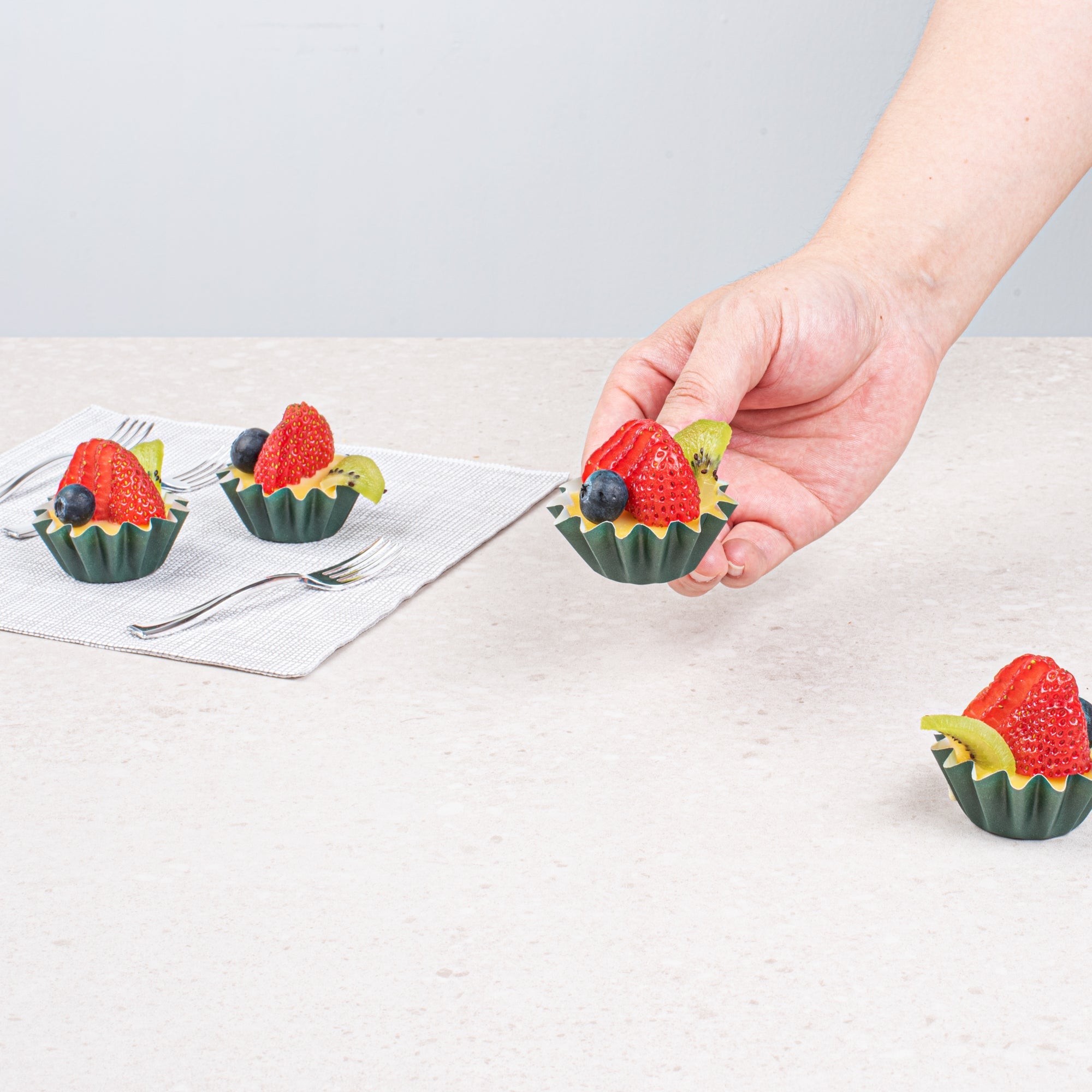 Panificio 0.4 oz Forest Green Floral Paper Mini Baking Cup - Flared - 2" x 2" x 1/2" - 200 count box
