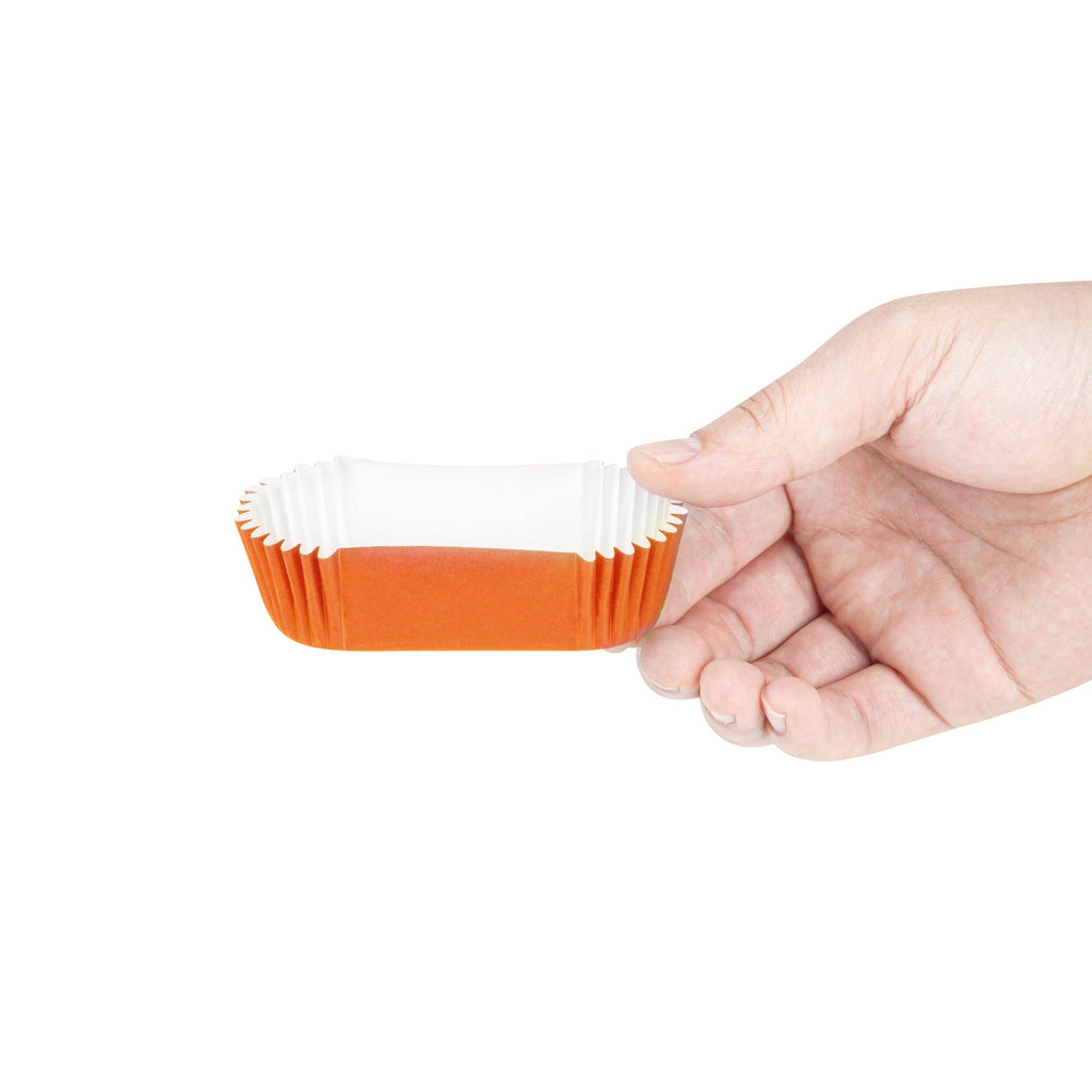 Panificio 1 oz Elliptical Tangerine Orange Paper Regular Baking Cup - Ridged - 3 1/2" x 1 1/2" x 3/4" - 200 count box