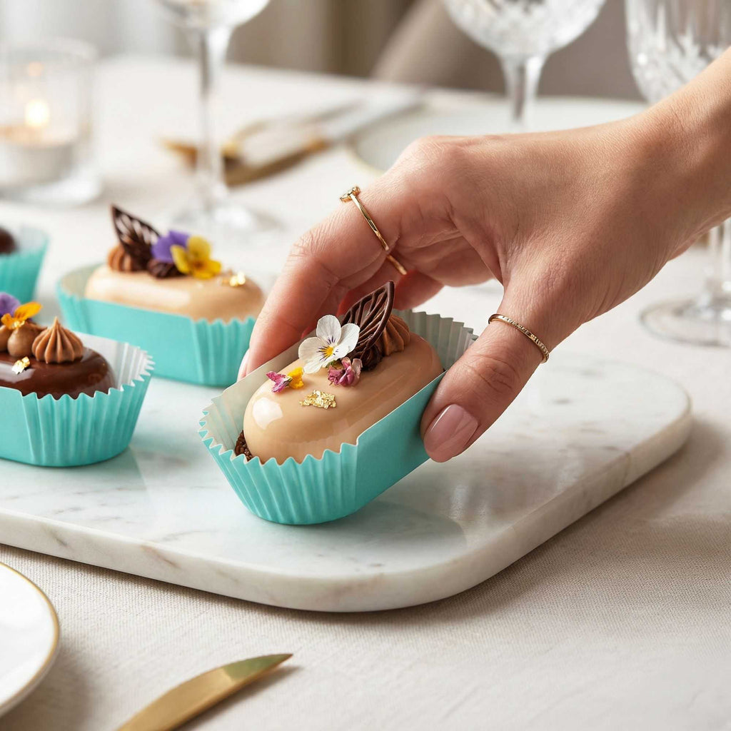 Panificio 1 oz Elliptical Turquoise Paper Regular Baking Cup - Ridged - 3 1/2" x 1 1/2" x 3/4" - 200 count box