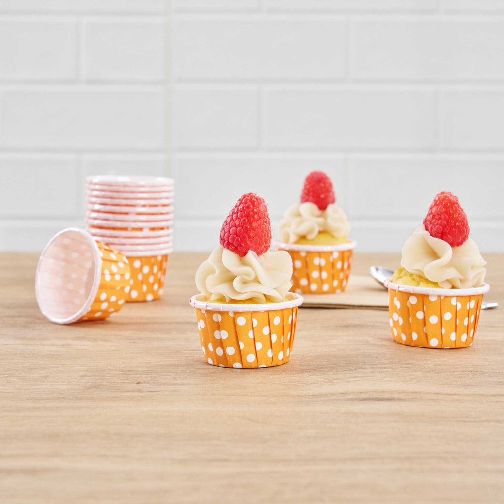 Panificio 1 oz Round Polka-Dotted Hot Orange Paper Small Baking Cup - Pleated - 2" x 2" x 1 1/4" - 200 count box