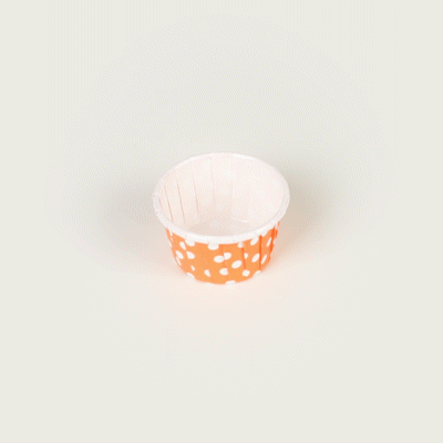 Panificio 1 oz Round Polka-Dotted Hot Orange Paper Small Baking Cup - Pleated - 2" x 2" x 1 1/4" - 200 count box