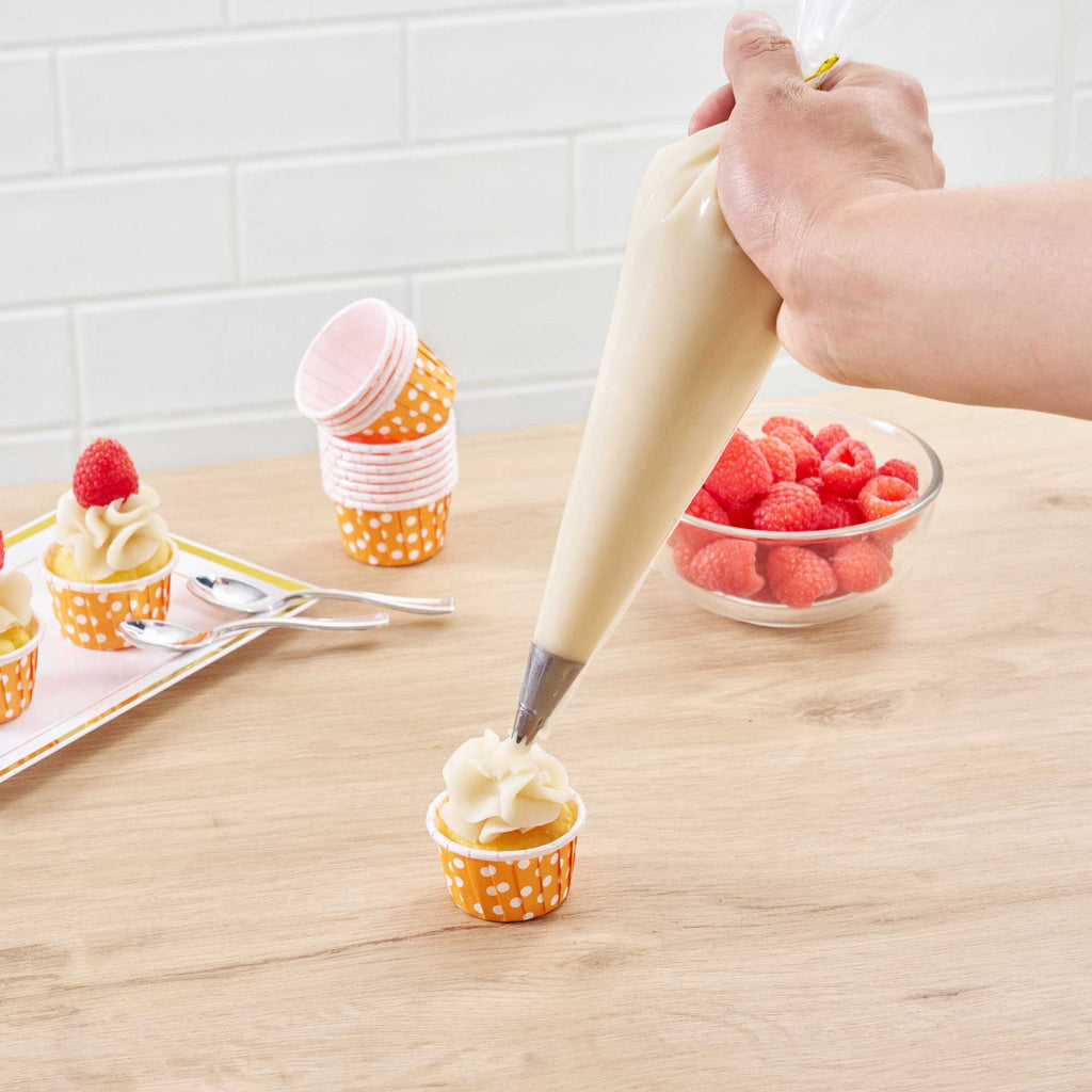 Panificio 1 oz Round Polka-Dotted Hot Orange Paper Small Baking Cup - Pleated - 2" x 2" x 1 1/4" - 200 count box