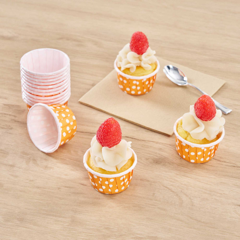 Panificio 1 oz Round Polka-Dotted Hot Orange Paper Small Baking Cup - Pleated - 2" x 2" x 1 1/4" - 200 count box