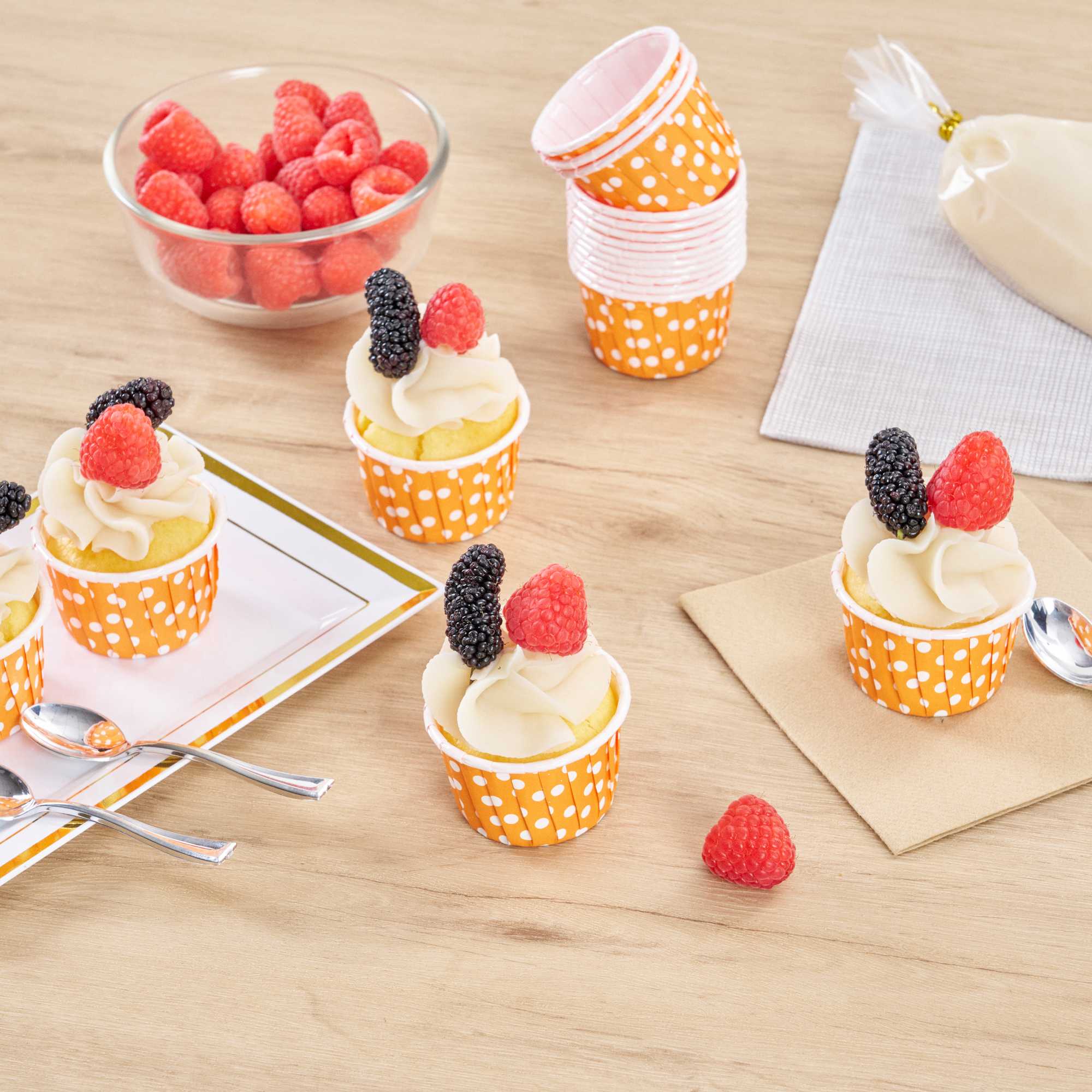 Panificio 2 oz Round Polka-Dotted Hot Orange Paper Medium Baking Cup - Pleated - 2 1/4" x 2 1/4" x 1 1/2" - 200 count box