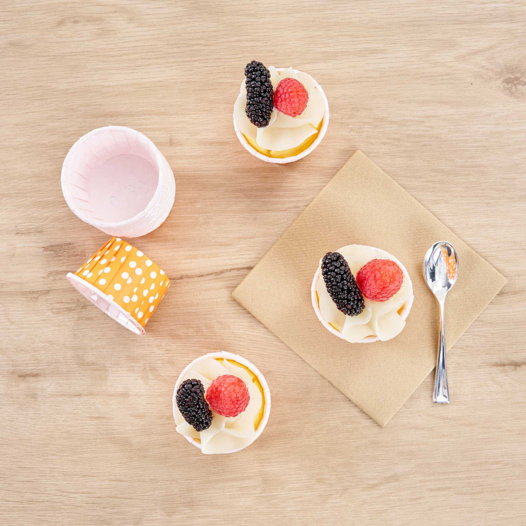 Panificio 2 oz Round Polka-Dotted Hot Orange Paper Medium Baking Cup - Pleated - 2 1/4" x 2 1/4" x 1 1/2" - 200 count box