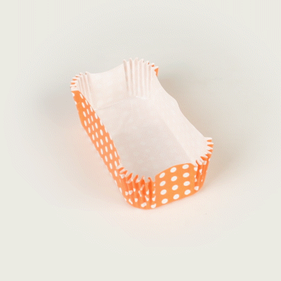 Panificio 5 oz Elliptical Polka-Dotted Hot Orange Paper Large Baking Cup - Ridged - 4 1/2" x 2 1/2" x 1 1/4" - 200 count box
