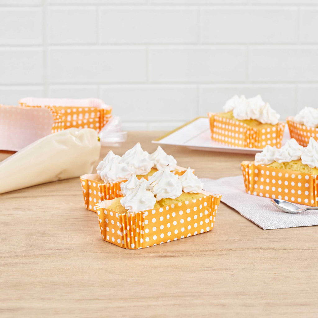 Panificio 5 oz Elliptical Polka-Dotted Hot Orange Paper Large Baking Cup - Ridged - 4 1/2" x 2 1/2" x 1 1/4" - 200 count box