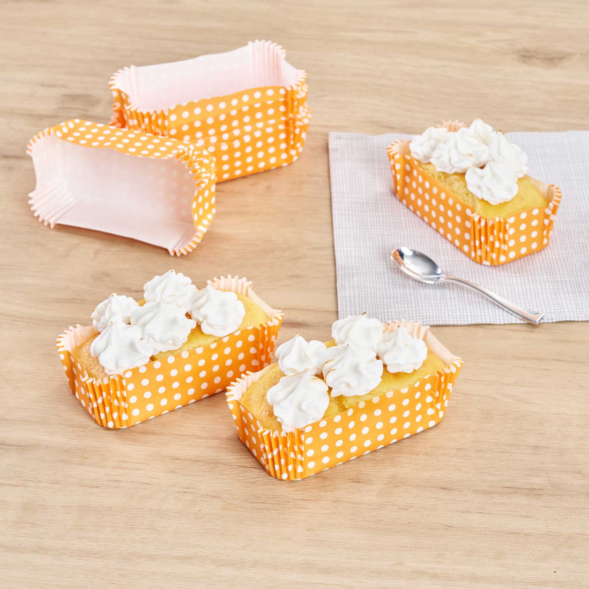 Panificio 5 oz Elliptical Polka-Dotted Hot Orange Paper Large Baking Cup - Ridged - 4 1/2" x 2 1/2" x 1 1/4" - 200 count box
