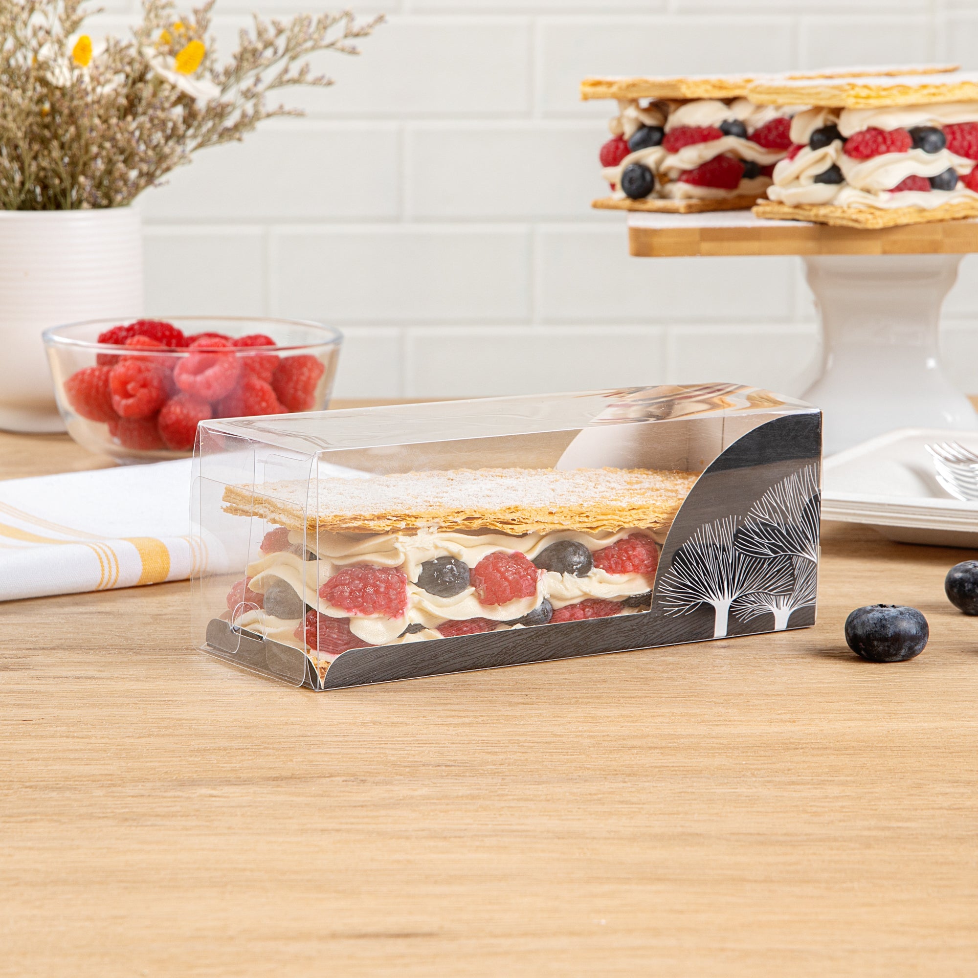 Sweet Vision Rectangle Clear Plastic Eclair Box - Black Paper Sleeve, Tree Accent - 7" x 2 1/2" x 2 1/2" - 100 count box