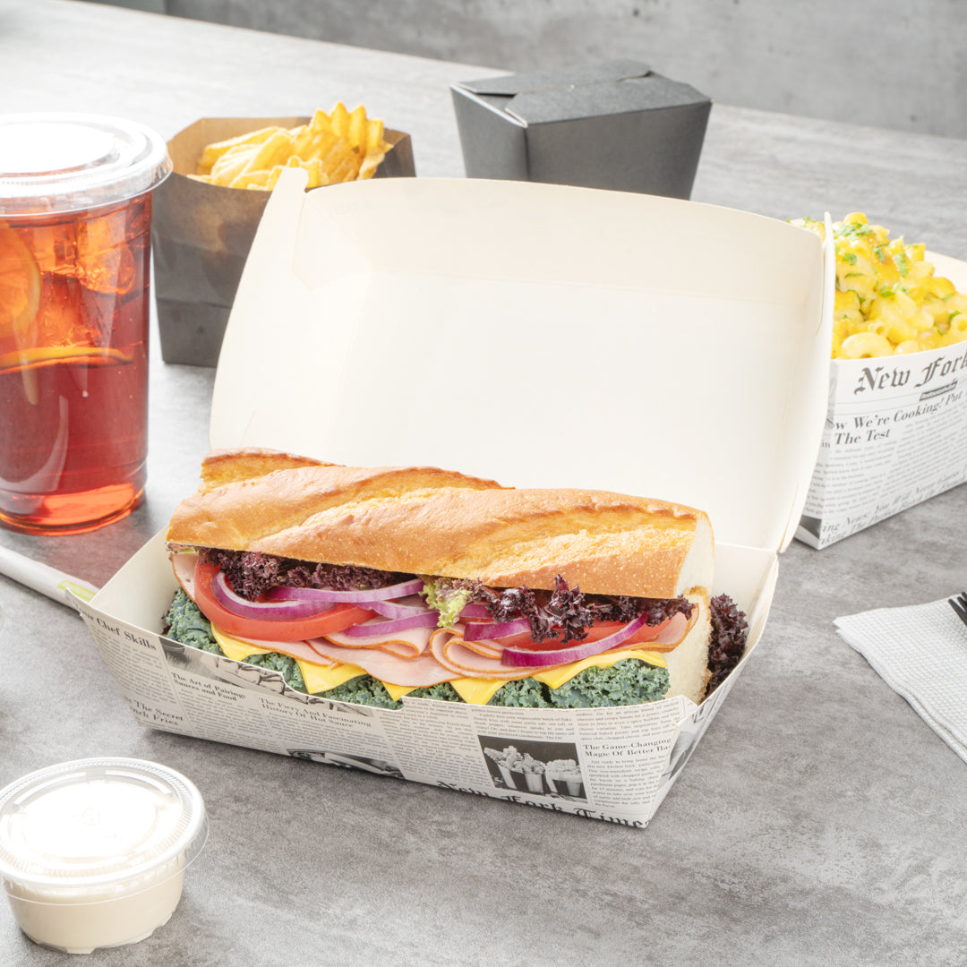 Bio Tek Rectangle Newsprint Paper Hot Dog / Sandwich Clamshell Container - 6 3/4" x 3 1/2" x 3 1/2" - 100 count box