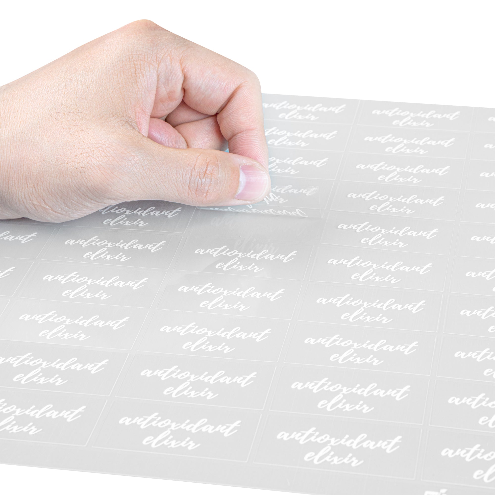 Label Tek Plastic Antioxidant Elixir Label - Clear with White Font, Water-Resistant - 2" x 1" - 100 count box