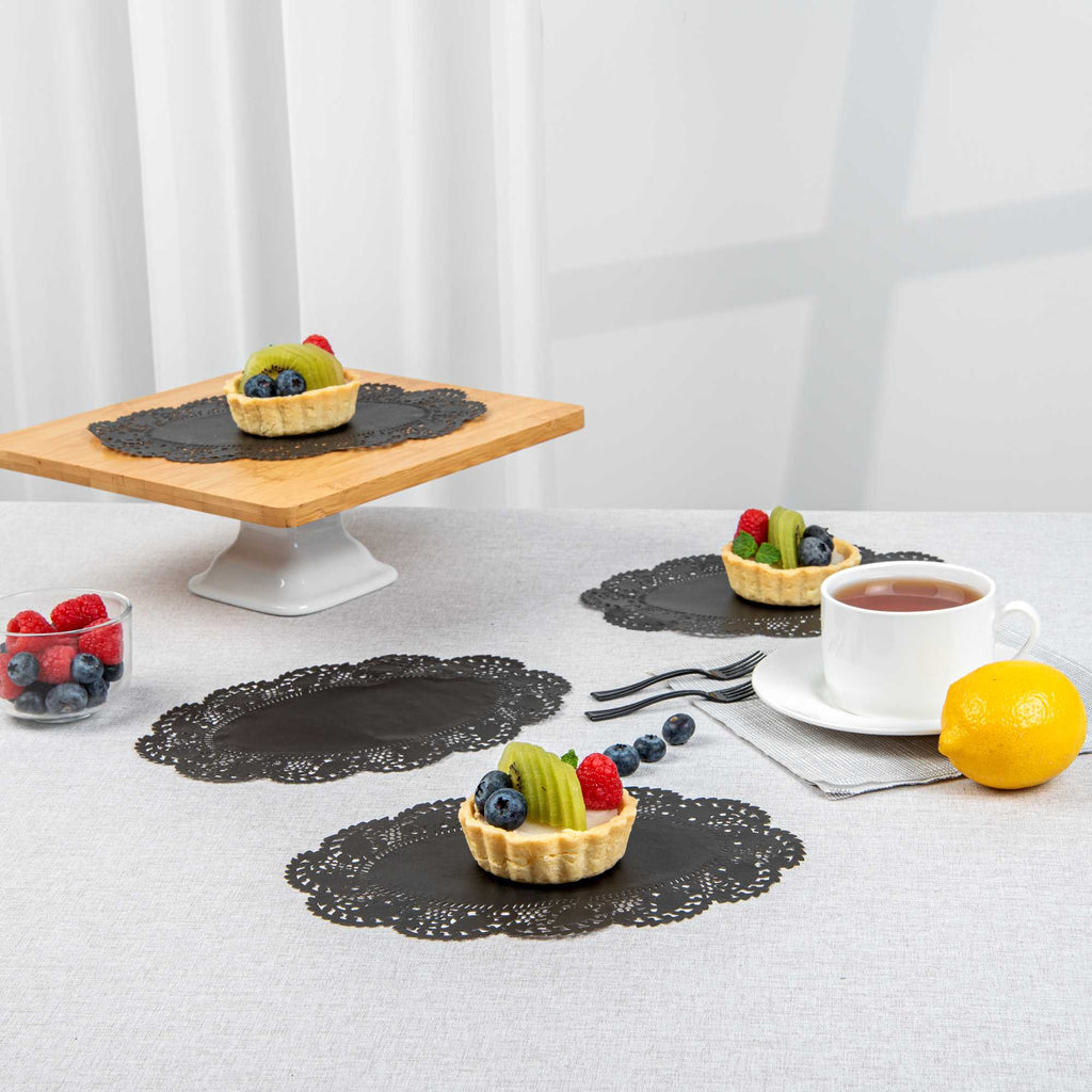 Pastry Tek Oval Black Paper Doilies - Lace - 9" x 6 1/2" - 100 count box