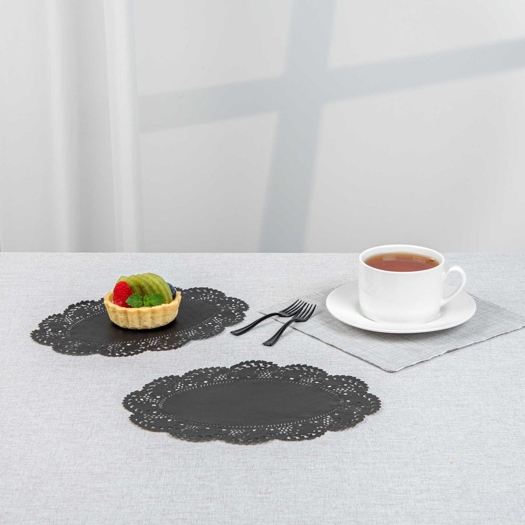 Pastry Tek Oval Black Paper Doilies - Lace - 9" x 6 1/2" - 100 count box