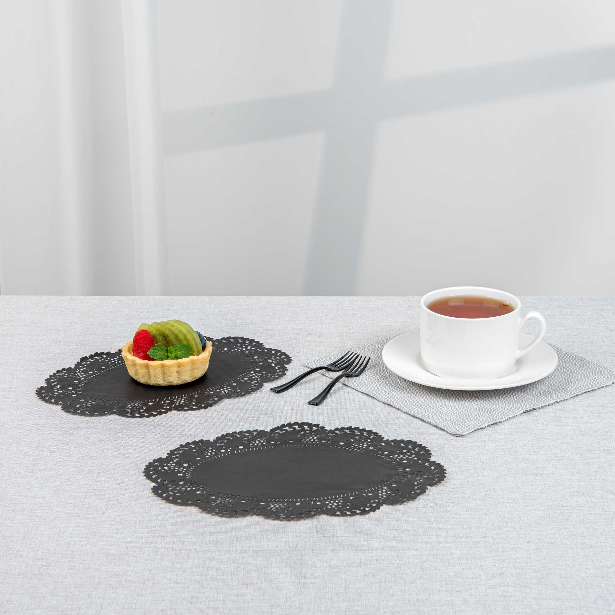 Pastry Tek Oval Black Paper Doilies - Lace - 9" x 6 1/2" - 100 count box