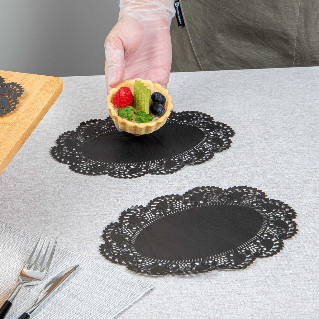 Pastry Tek Oval Black Paper Doilies - Lace - 9" x 6 1/2" - 100 count box