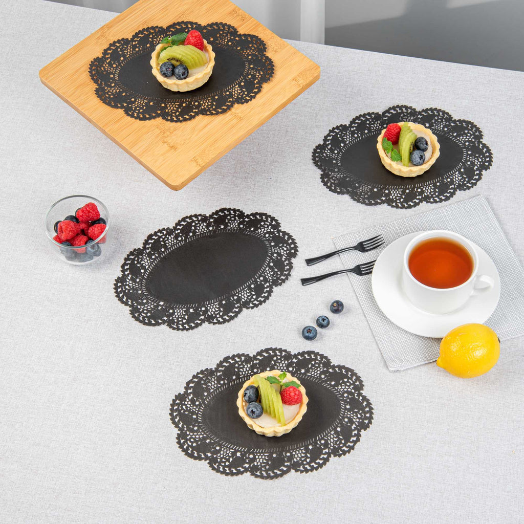 Pastry Tek Oval Black Paper Doilies - Lace - 9" x 6 1/2" - 4000 count box