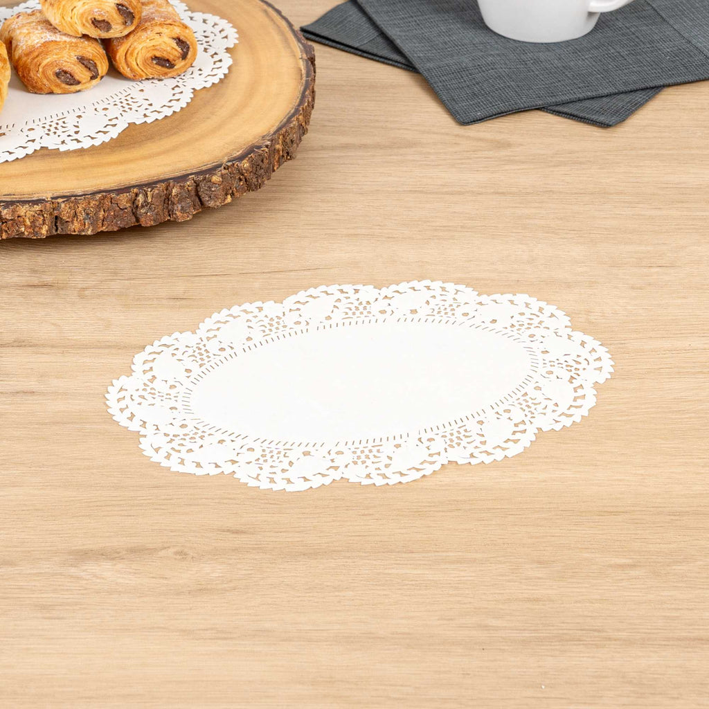Pastry Tek Oval White Paper Doilies - Lace - 9" x 6 1/2" - 100 count box
