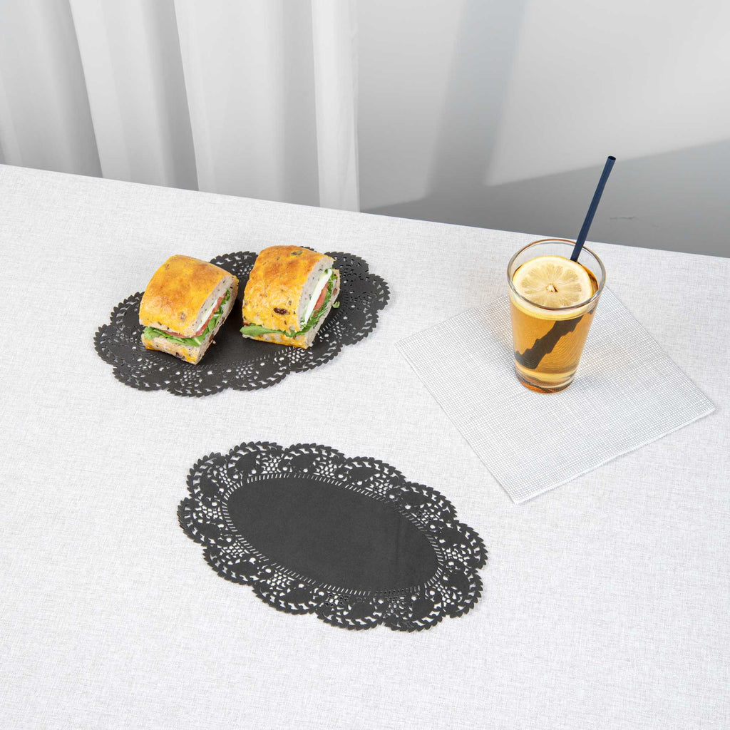 Pastry Tek Oval Black Paper Doilies - Lace - 10 1/2" x 6 1/2" - 4000 count box