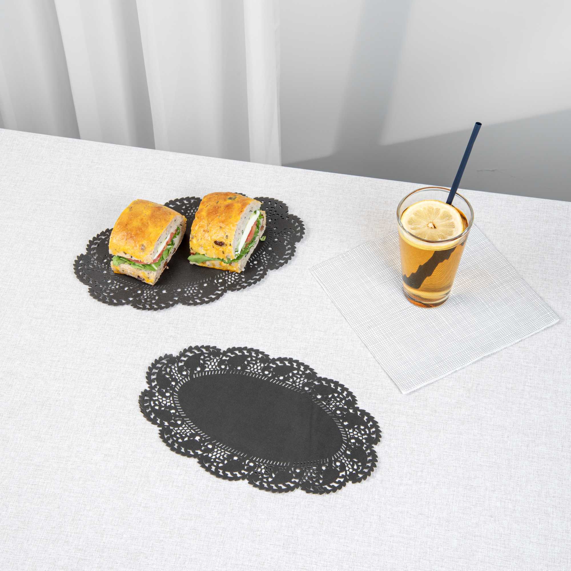 Pastry Tek Oval Black Paper Doilies - Lace - 10 1/2" x 6 1/2" - 4000 count box