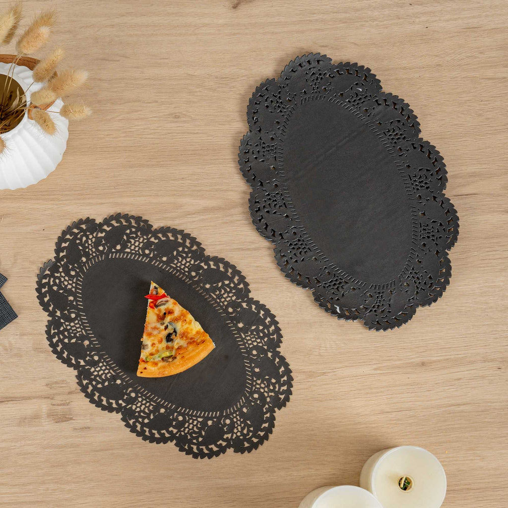 Pastry Tek Oval Black Paper Doilies - Lace - 12 1/2" x 8 1/2" - 100 count box