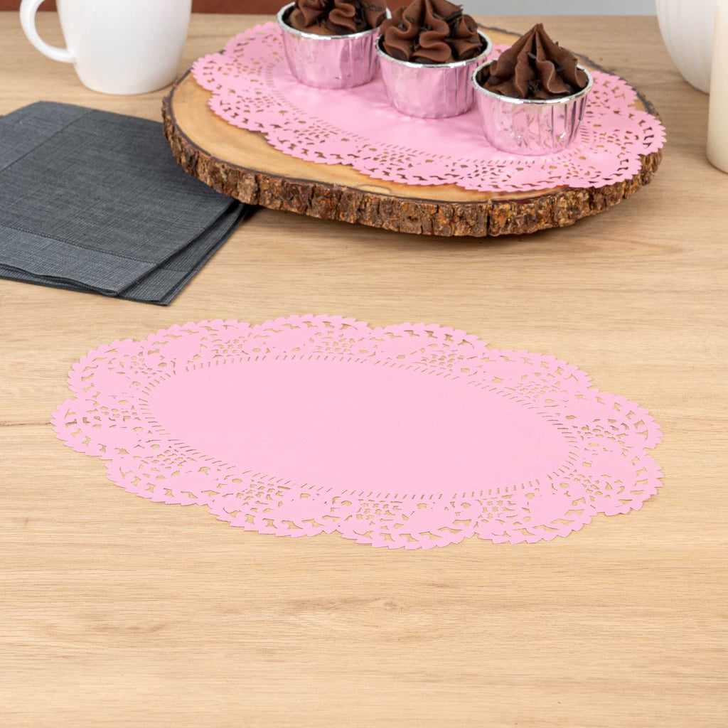 Pastry Tek Oval Pink Paper Doilies - Lace - 12 1/2" x 8 1/2" - 100 count box