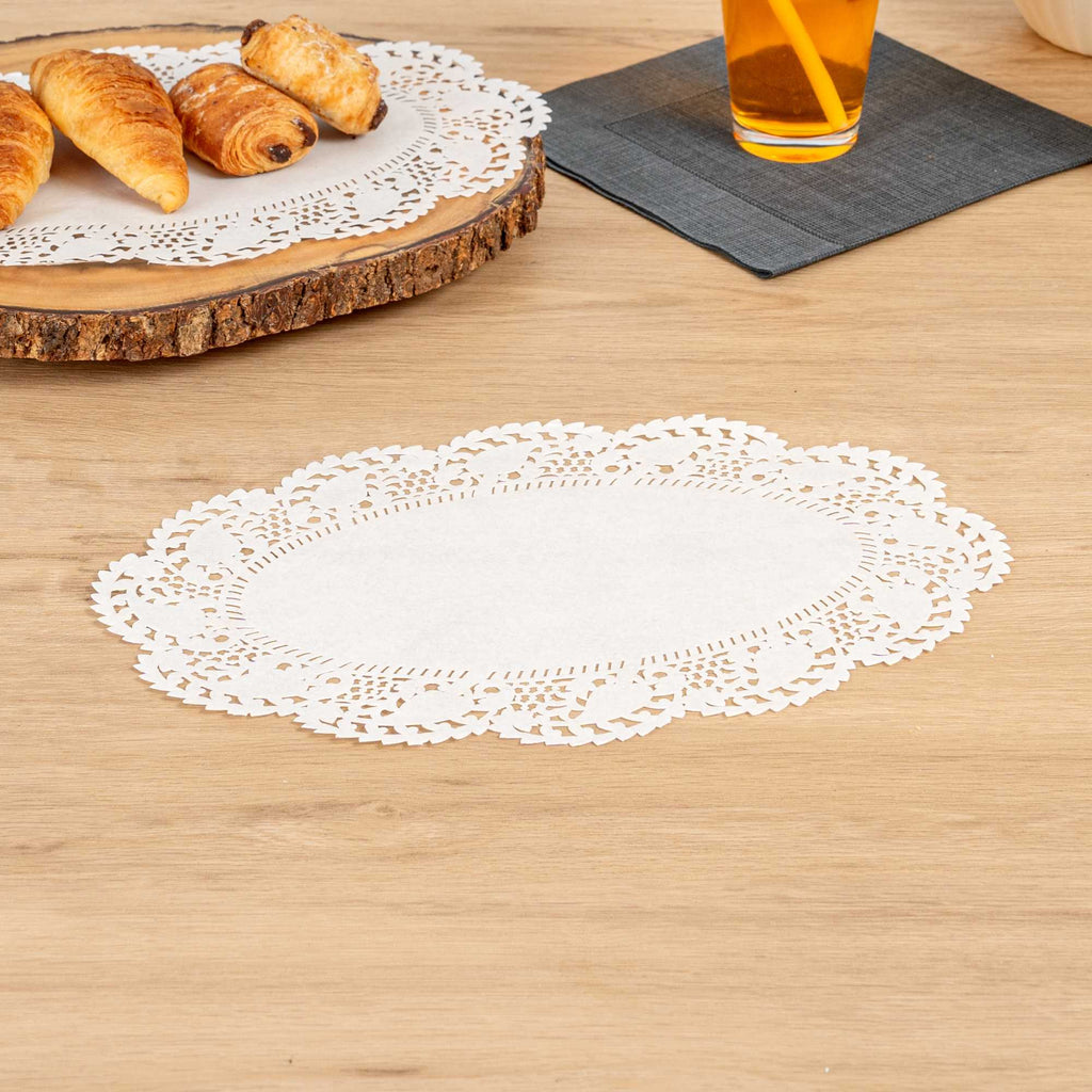 Pastry Tek Oval White Paper Doilies - Lace - 12 1/2" x 8 1/2" - 100 count box