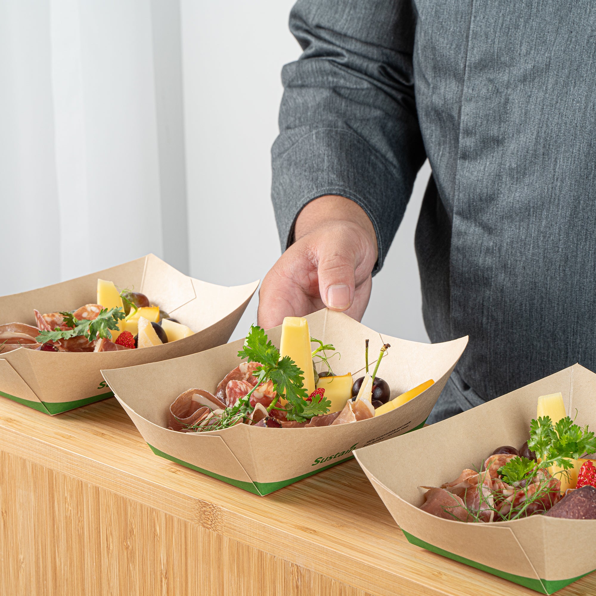 Sustain 1 lb Bamboo Paper #100 Food Tray / Boat - with PLA Lining, Compostable - 5 1/2" x 3 1/2" x 2" - 50 count box