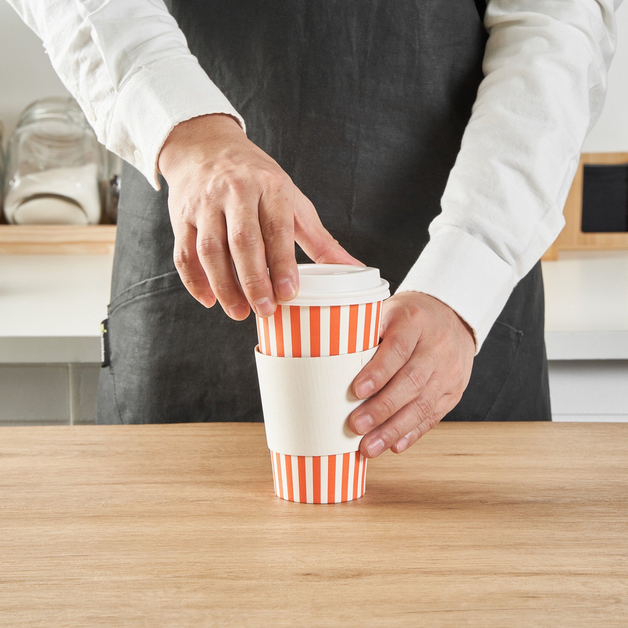 Restpresso 16 oz Orange and White Stripe Paper Single Wall Coffee Cup - with White Lid - 3 1/2"x 3 1/2"x 5 3/4" - 20 count box