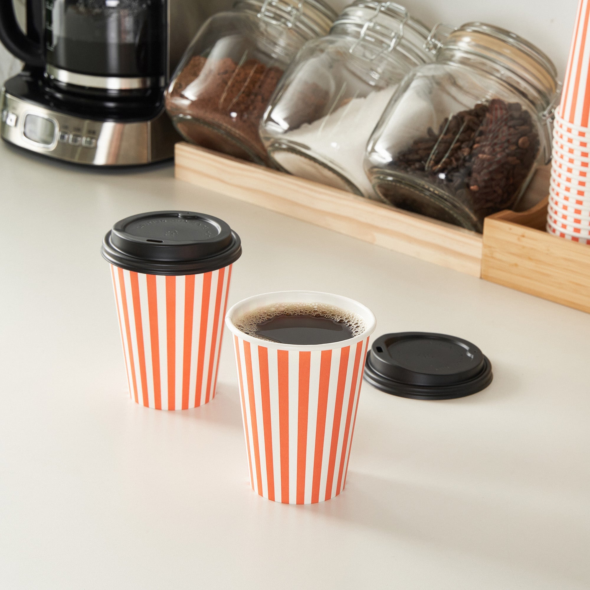 Restpresso 12 oz Orange and White Stripe Paper Single Wall Coffee Cup - with Black Lid - 3 1/2"x 3 1/2"x 4 1/4" - 20 count box