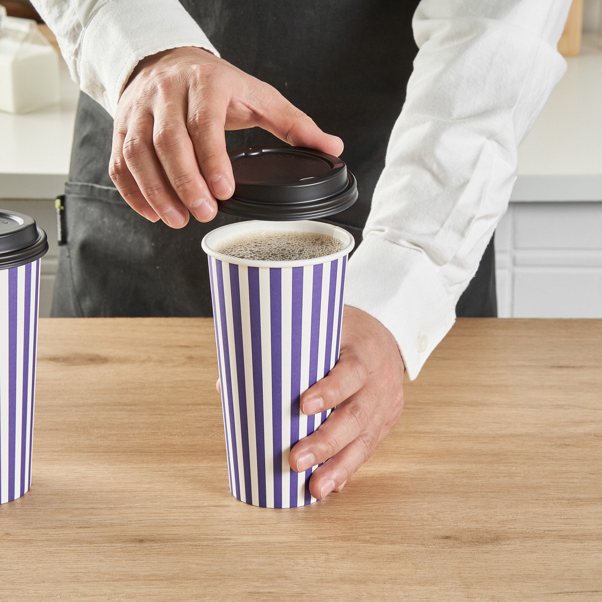 Restpresso 20 oz Purple and White Stripe Paper Single Wall Coffee Cup - with Black Lid - 3 1/2"x 3 1/2"x 6 1/4" - 20 count box
