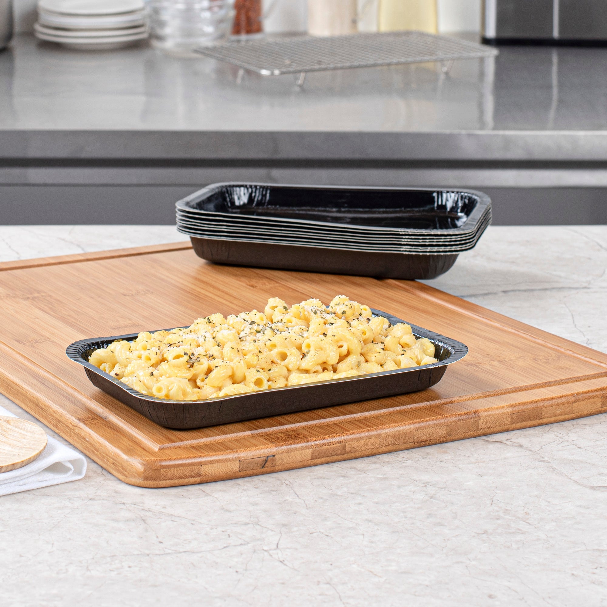 Pastry Tek 15 oz Rectangle Black Paperboard Tray - Oven-Safe - 8 1/4" x 5 1/2" x 1" - 25 count box
