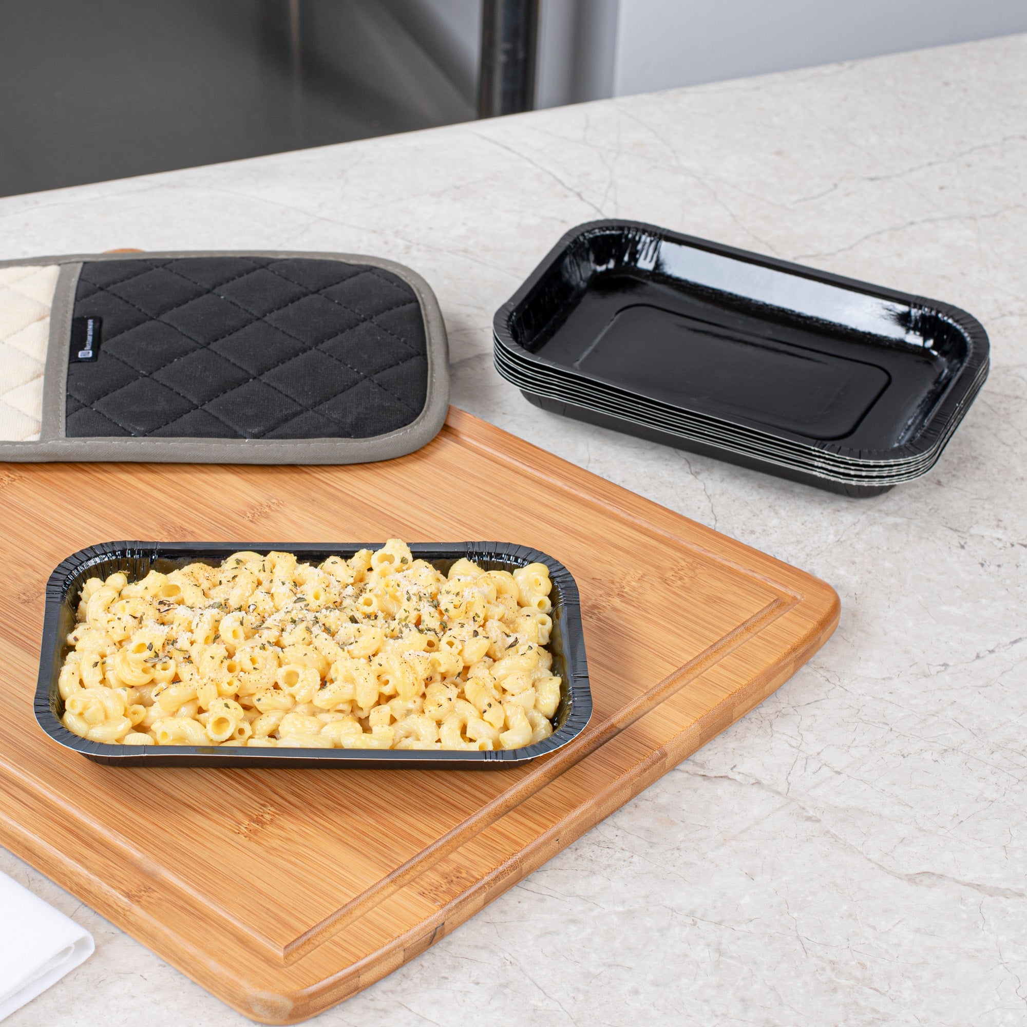 Pastry Tek 15 oz Rectangle Black Paperboard Tray - Oven-Safe - 8 1/4" x 5 1/2" x 1" - 25 count box