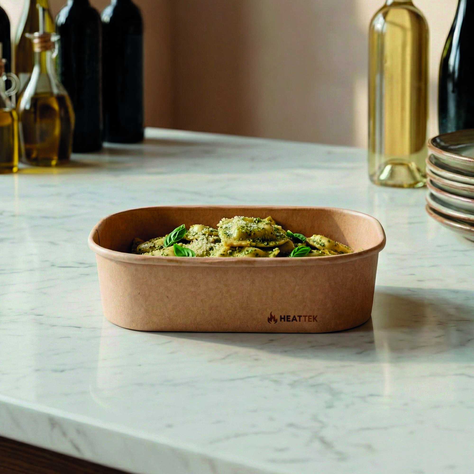 Heat Tek 17 oz Oval Kraft Paper Serving Container - Oven-Safe - 6 3/4" x 4 3/4" x 1 1/2" - 25 count box