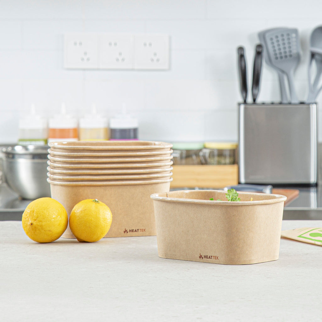 Heat Tek 34 oz Oval Kraft Paper Serving Container - Oven-Safe - 6 3/4" x 4 3/4" x 3" -100 count box