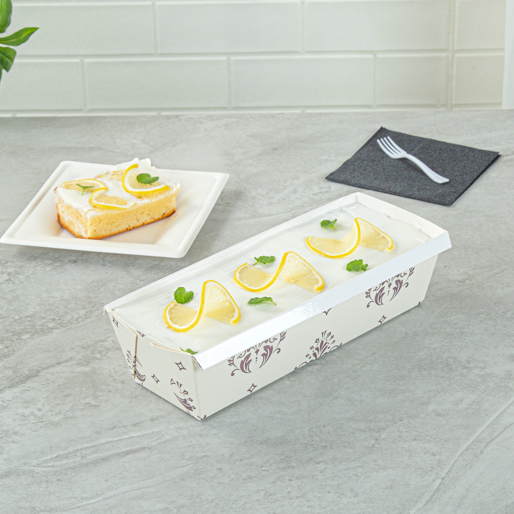 Bake Tek 42 oz Beige Vintage Floral Paper Baking Loaf Pan - Greaseproof - 10" x 3 1/2" x 2 1/2" - 100 count box
