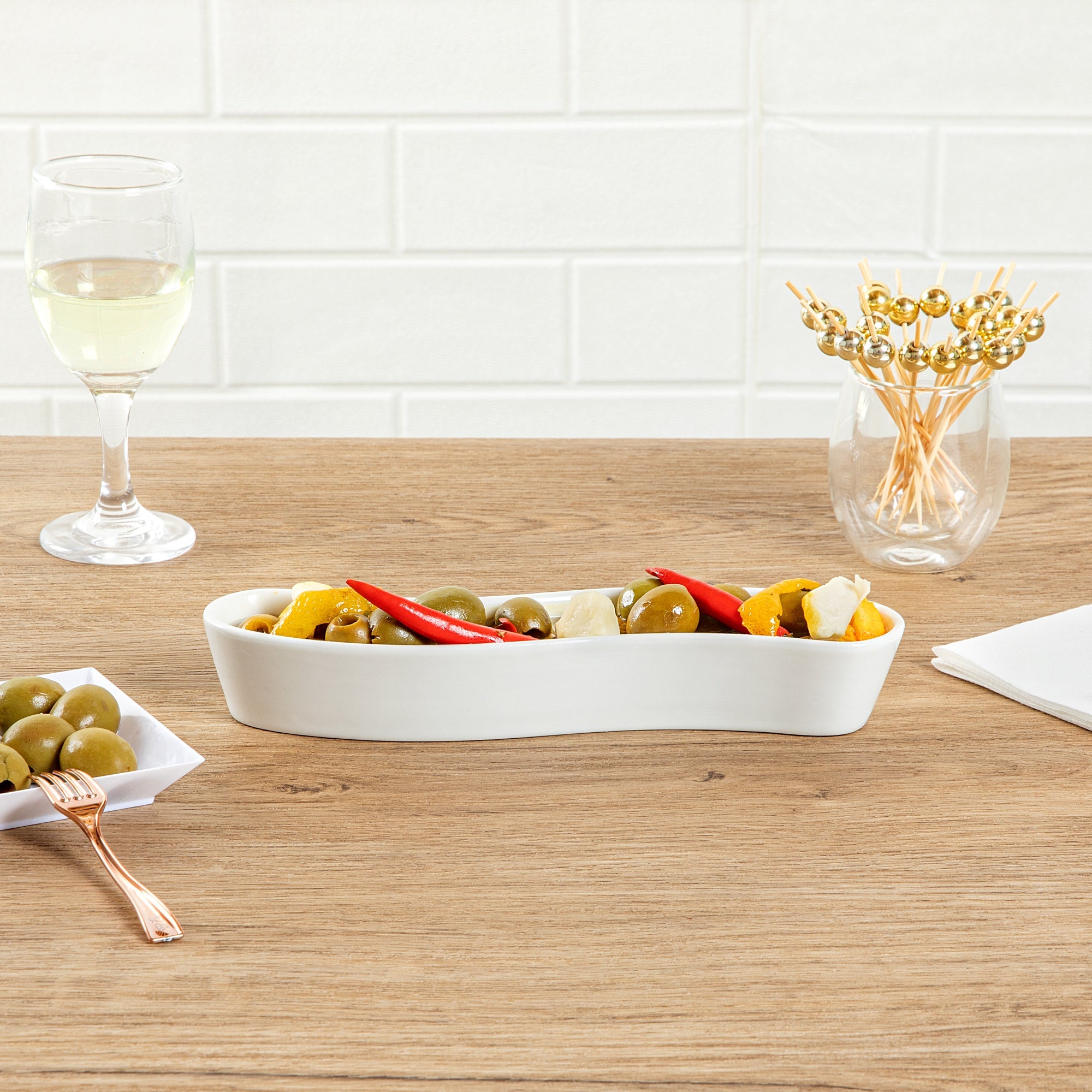 Chef 101 Swerve 6 oz Curved White Porcelain Olive Plate - 8 3/4" x 2 1/4" x 1 1/2" - 1 count box