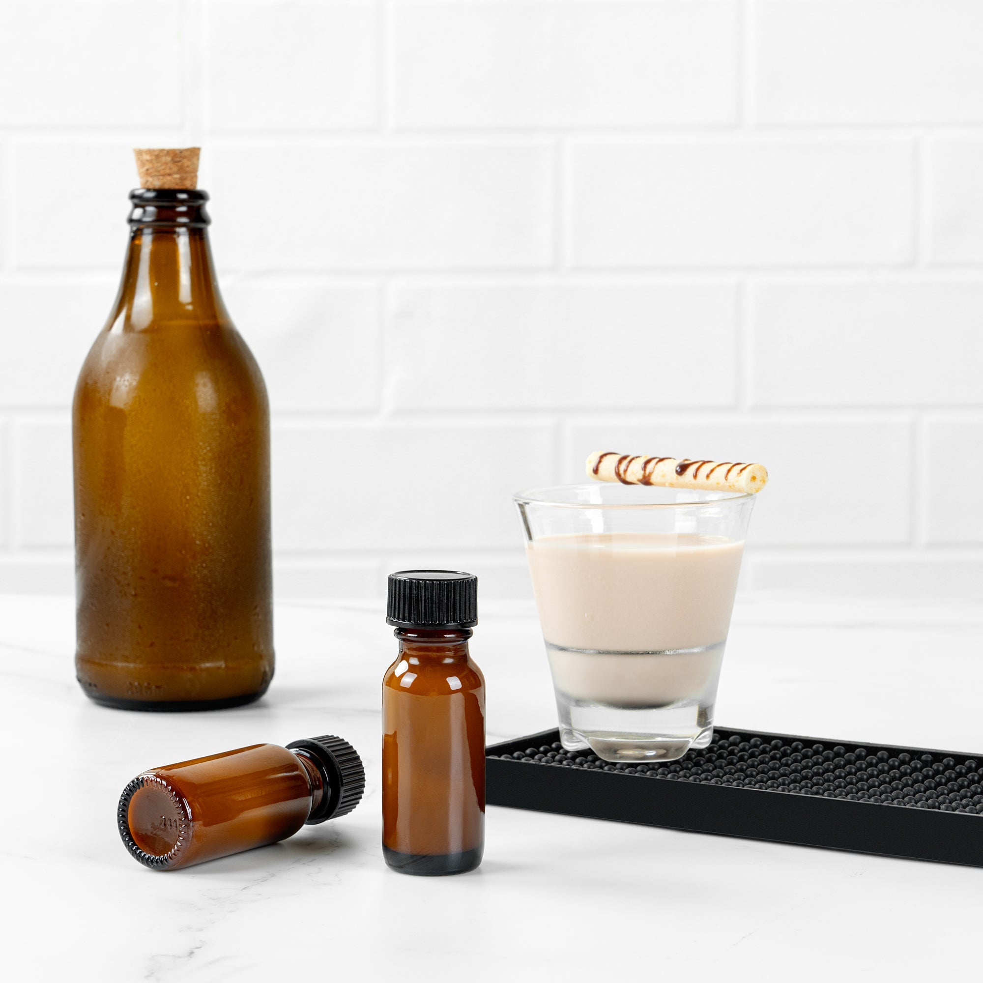 Vetri 0.5 oz Boston Round Amber Glass Bottle - with Black Phenolic Cap - 1" x 1" x 2 3/4" - 48 count box