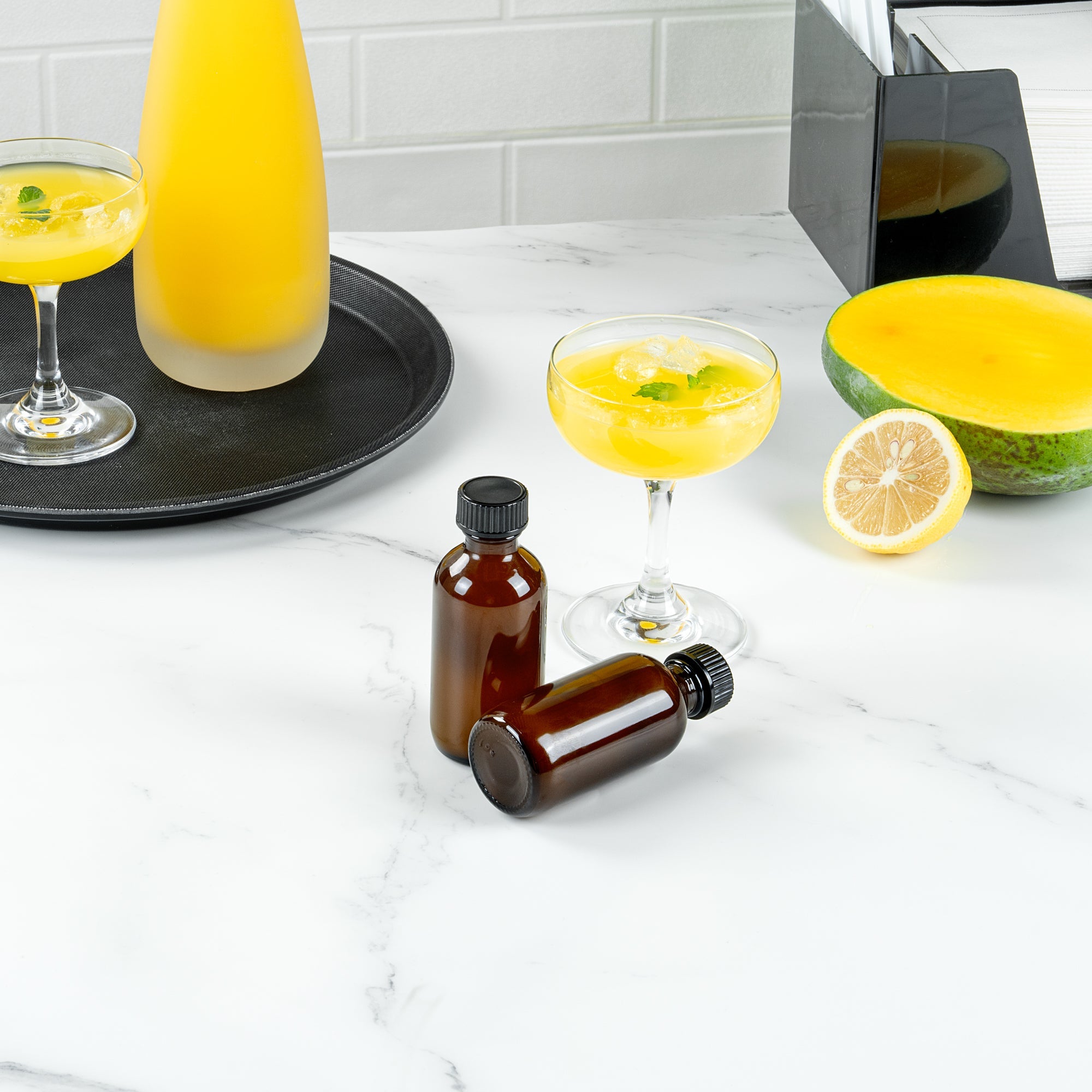 Vetri 2 oz Boston Round Amber Glass Bottle - with Black Phenolic Cap - 1 1/2" x 1 1/2" x 3 3/4" - 48 count box