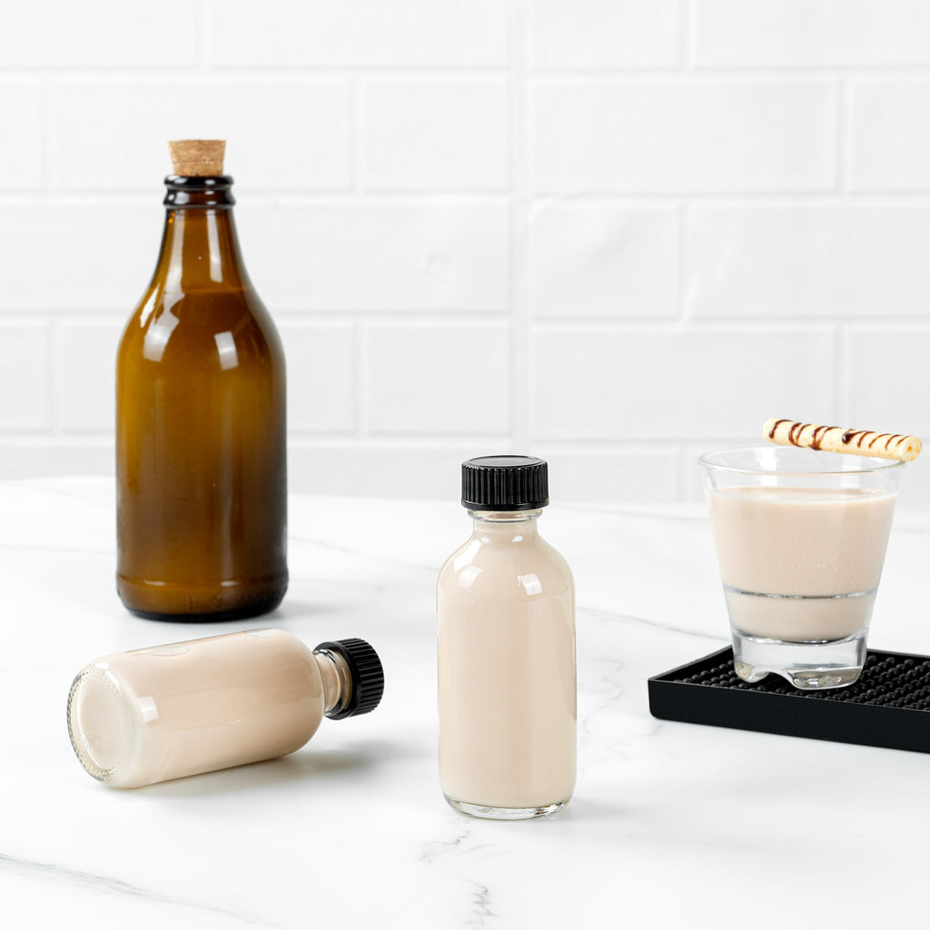 Vetri 2 oz Boston Round Clear Glass Bottle - with Black Phenolic Cap - 1 1/2" x 1 1/2" x 3 3/4" - 48 count box