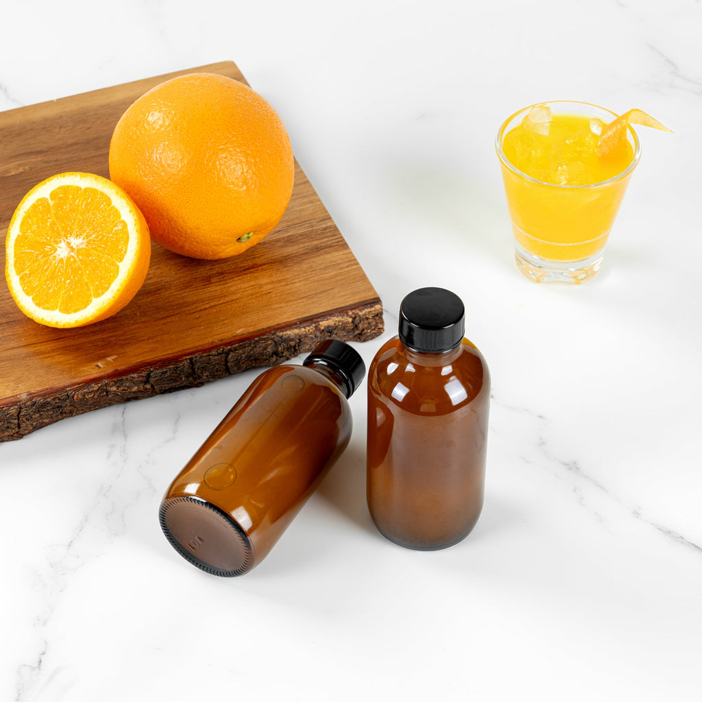 Vetri 4 oz Boston Round Amber Glass Bottle - with Black Phenolic Cap - 2" x 2" x 4 1/2" - 24 count box