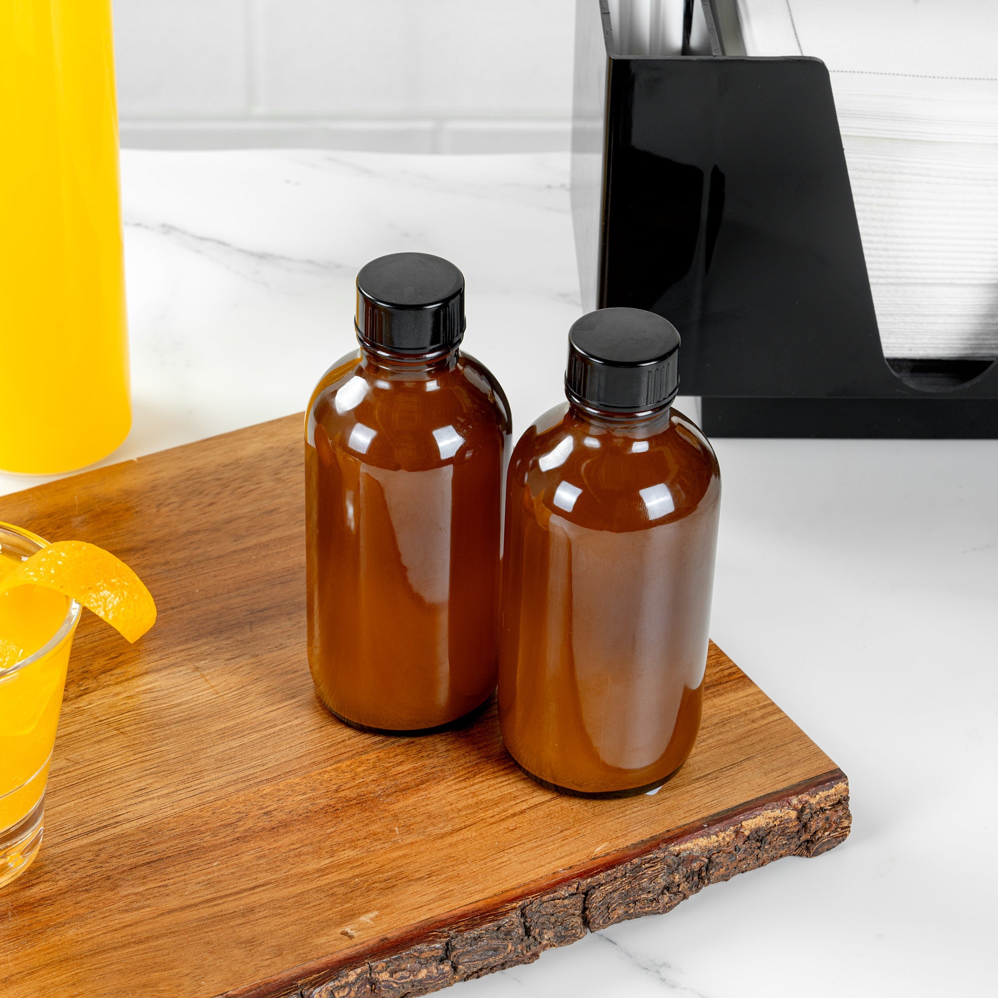 Vetri 4 oz Boston Round Amber Glass Bottle - with Black Phenolic Cap - 2" x 2" x 4 1/2" - 24 count box