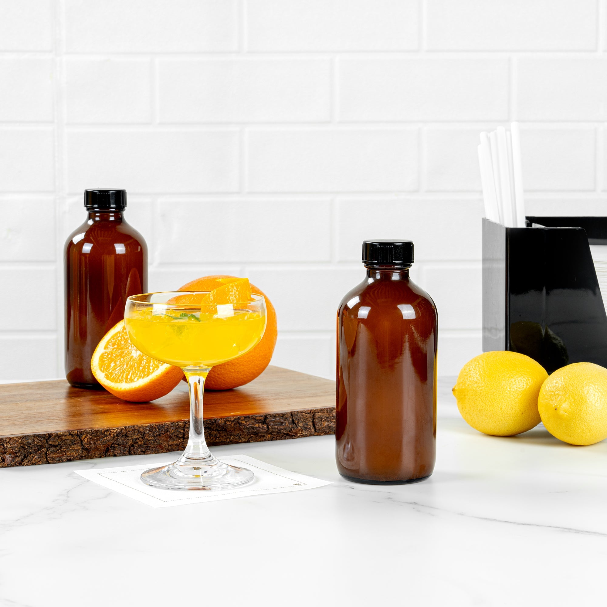 Vetri 8 oz Boston Round Amber Glass Bottle - with Black Phenolic Cap - 2 1/2" x 2 1/2" x 5 1/2" - 12 count box