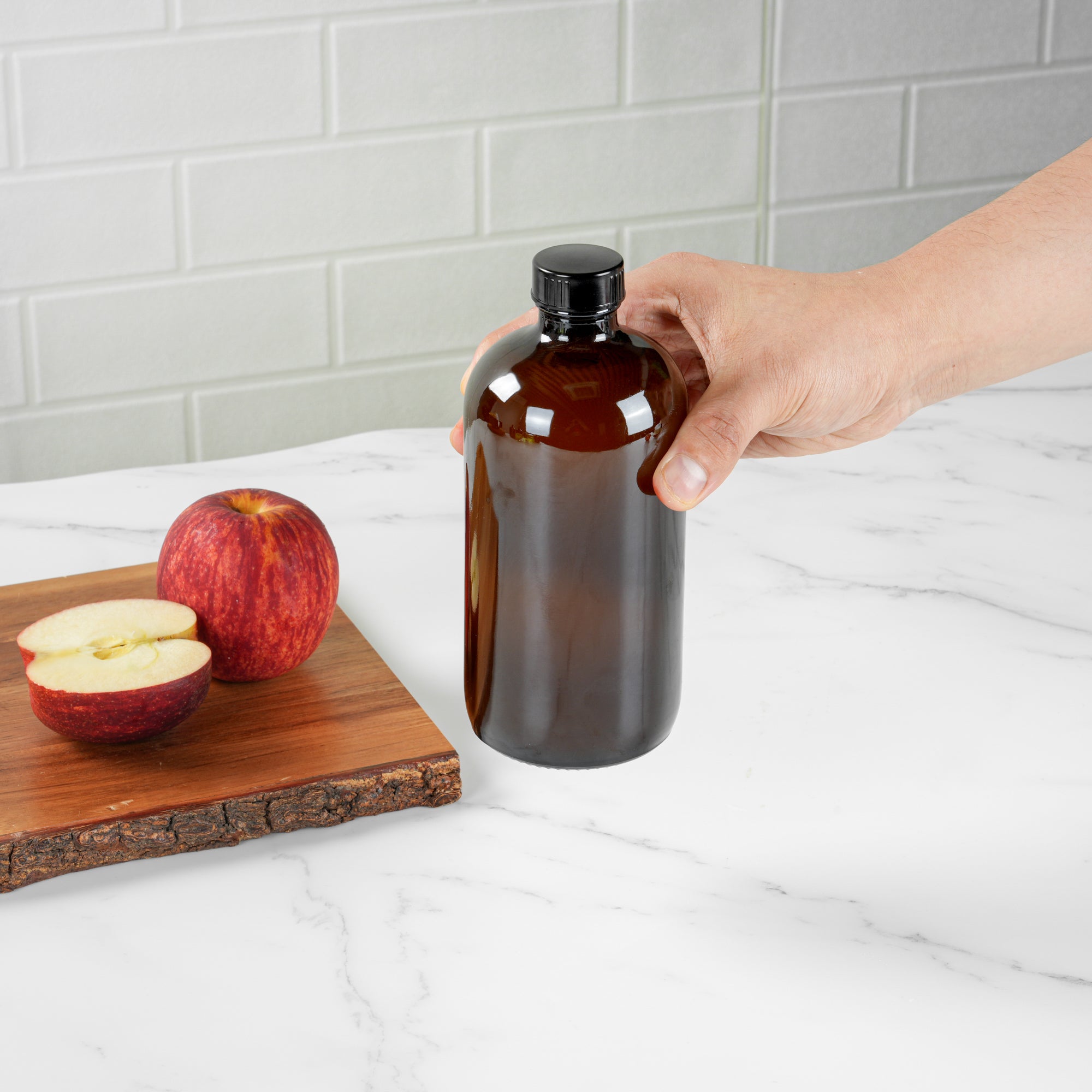 Vetri 16 oz Boston Round Amber Glass Bottle - with Black Phenolic Cap - 3" x 3" x 6 3/4" - 12 count box