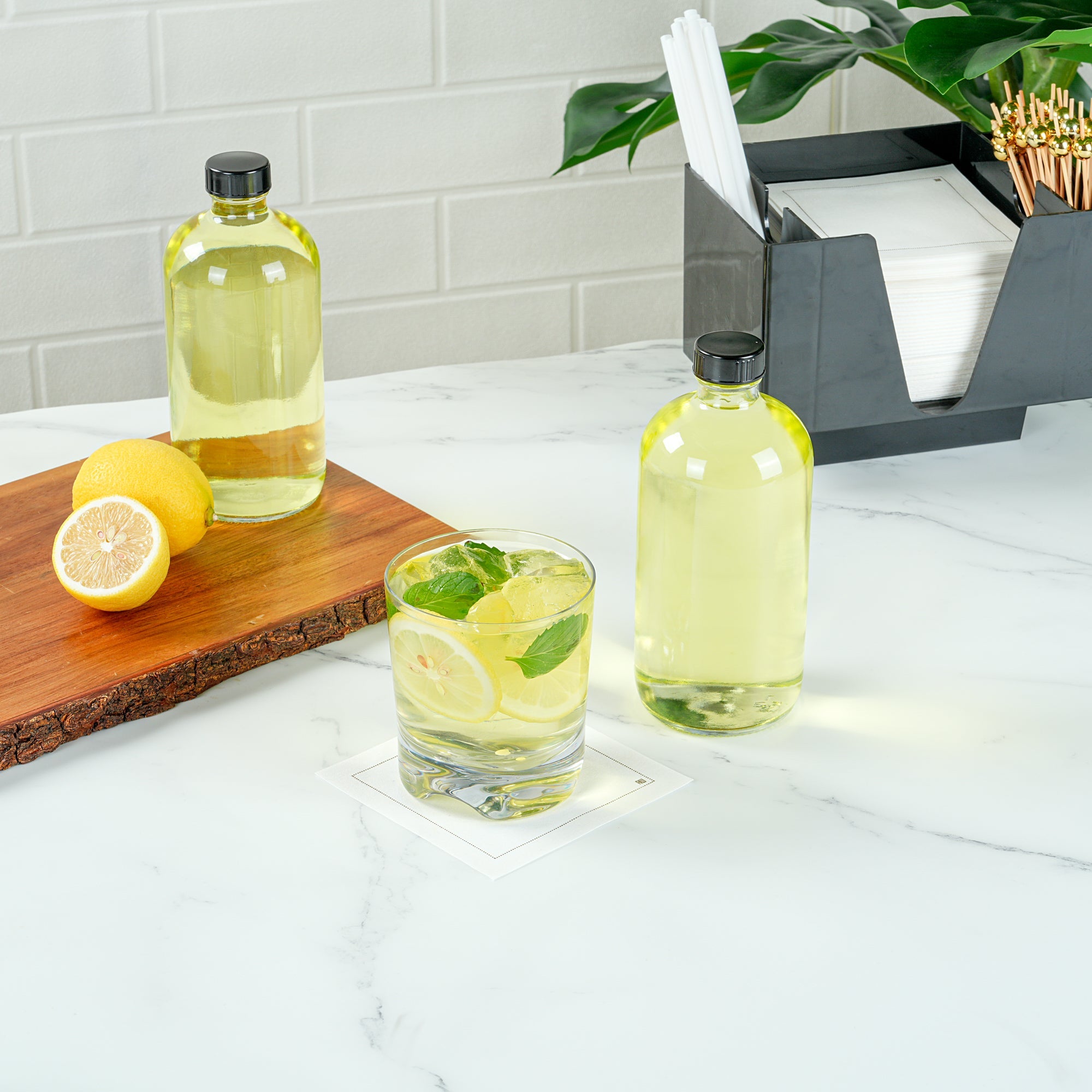 Vetri 16 oz Boston Round Clear Glass Bottle - with Black Phenolic Cap - 3" x 3" x 6 3/4" - 12 count box