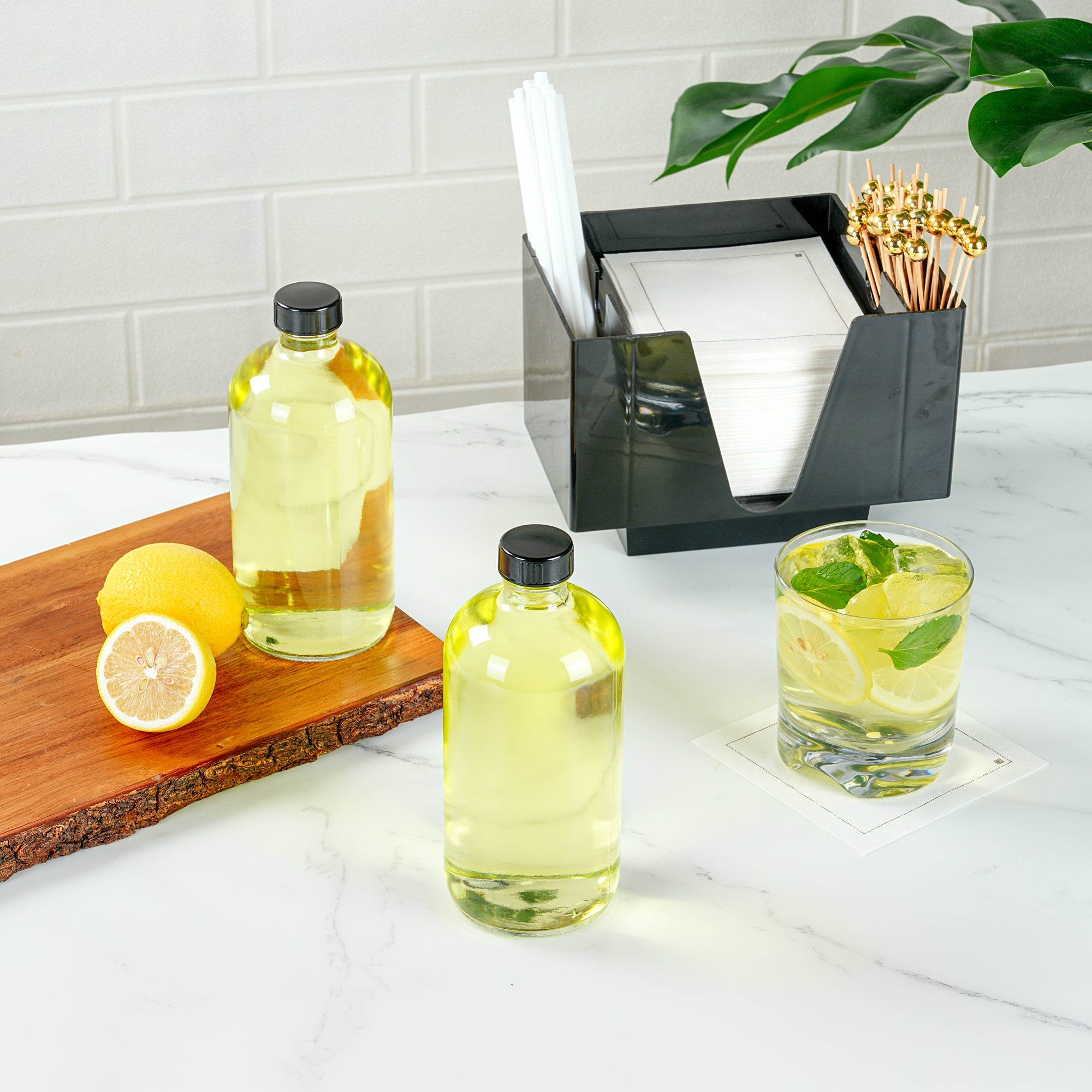 Vetri 16 oz Boston Round Clear Glass Bottle - with Black Phenolic Cap - 3" x 3" x 6 3/4" - 12 count box