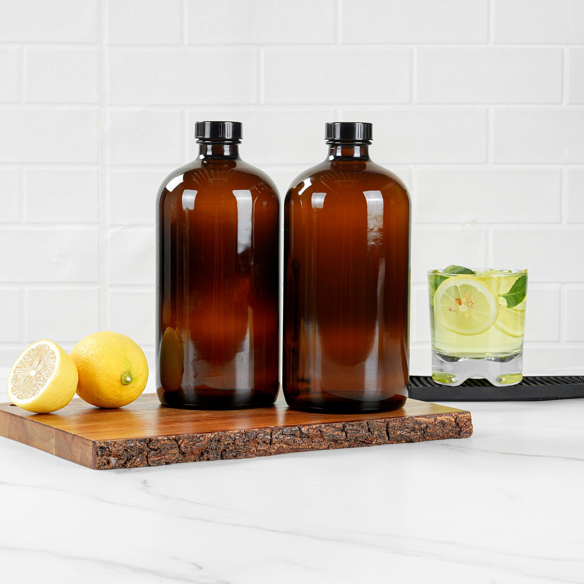 Vetri 32 oz Boston Round Amber Glass Bottle - with Black Phenolic Cap - 3 3/4" x 3 3/4" x 8" - 12 count box